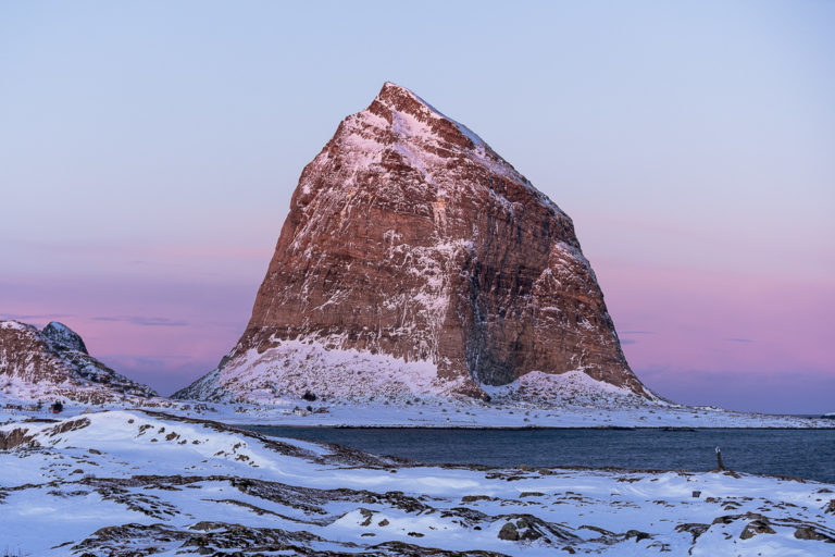 Mount Trænstaven in reddish winter light. The Trænstaven at 338 metres can only be climbed with ropes, but there are lots of other nice tours on the island of Sanna © Arvids Baranovs