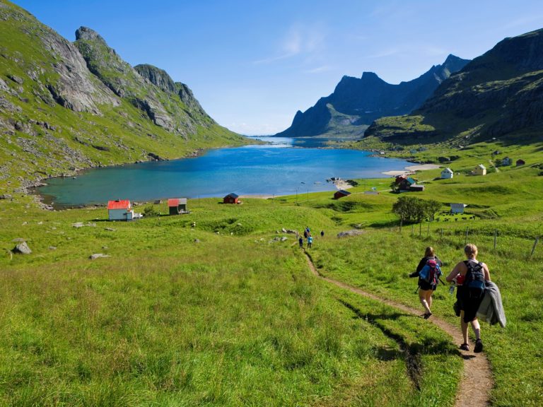 Hikers in Bunesfjorden at Reine, Moskenes. Photo: Bård Løken / nordnorge.com