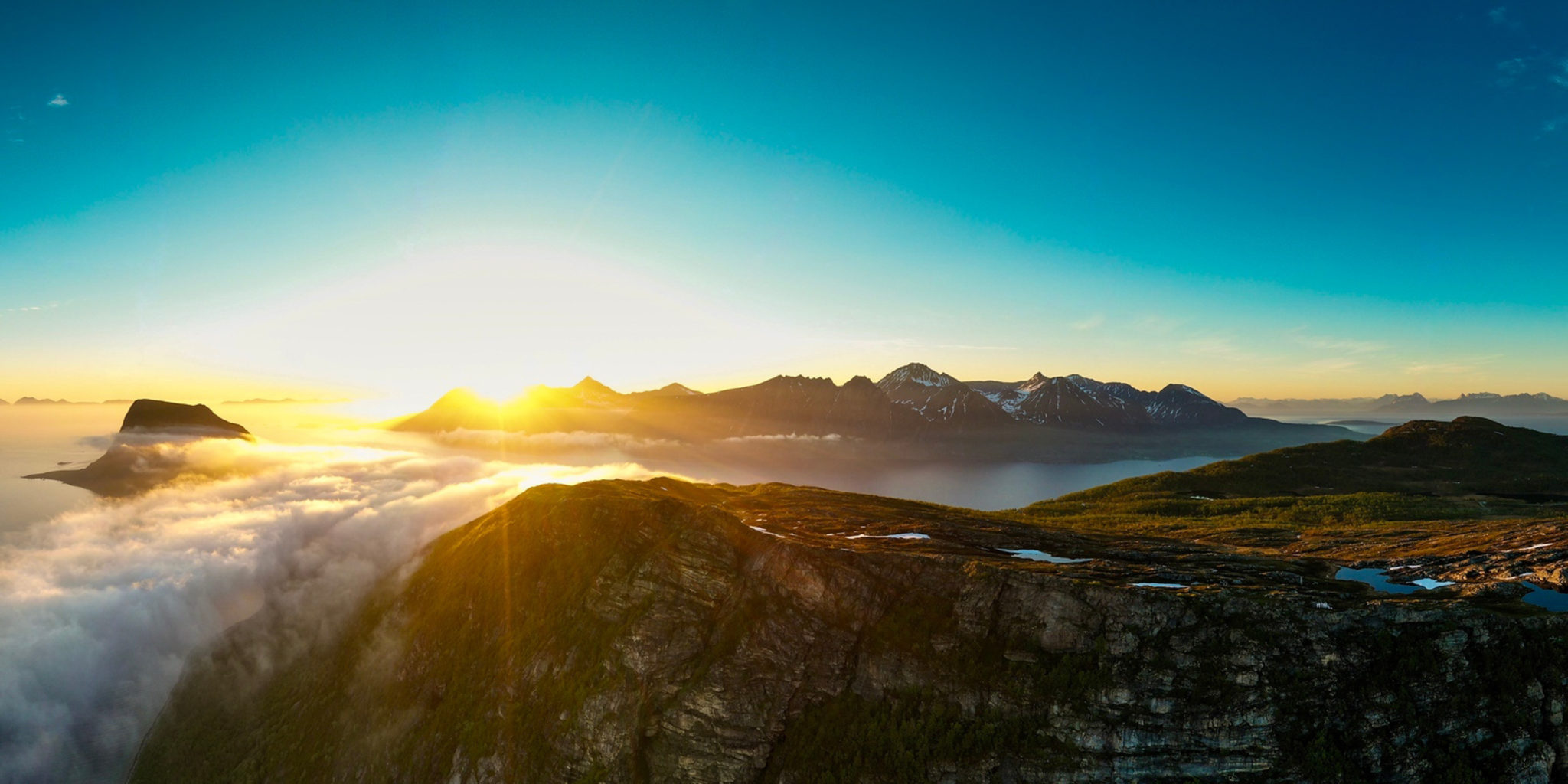 Midnight Sun over the Andfjord. The island of Grytøya in the north, and left/northwest is Cape Elgsnes © Øivind Arvola / Harstad kommune