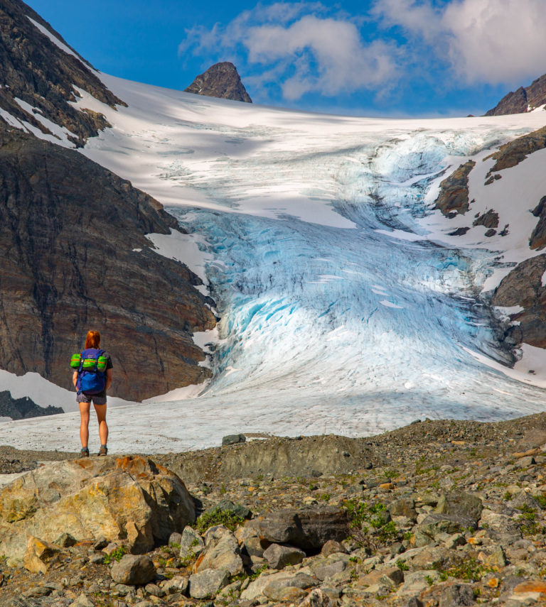 Blue between the towering peaks of the Lyngen Alps. The Steindalsbreen glacier © William Copeland