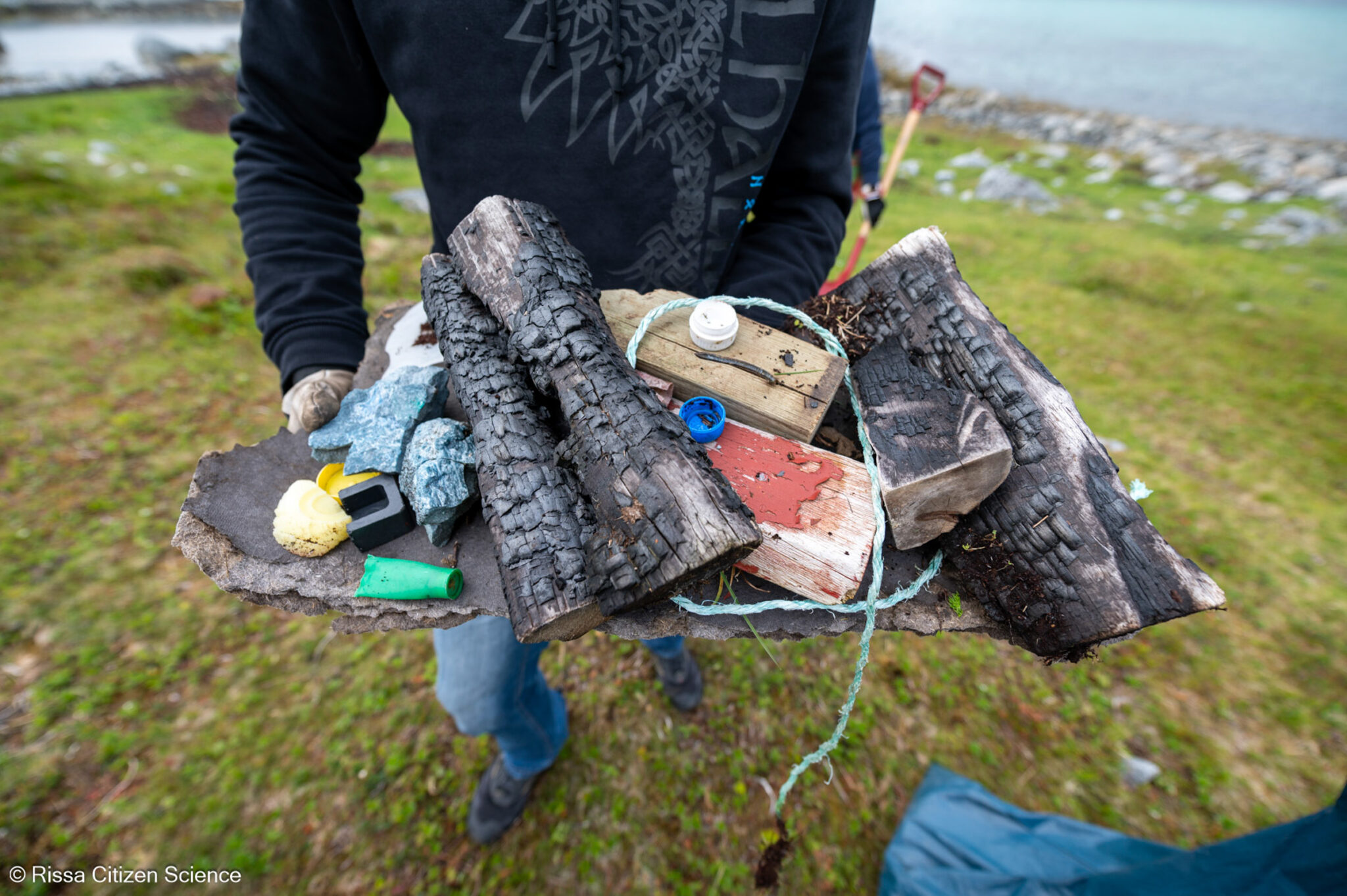 Charred wood. And all sorts of other rubbish. If attached bottle caps annoy you, this is exactly why.© Rissa Citizen Science